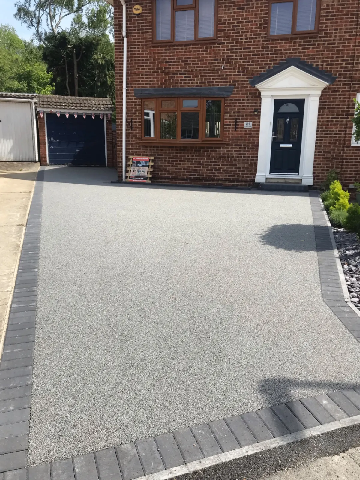 Modern garden with clean patio and border planting